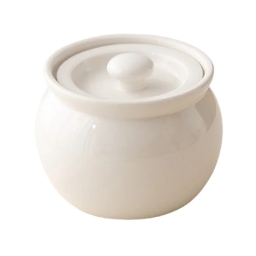 White ceramic jar with lid on a white background