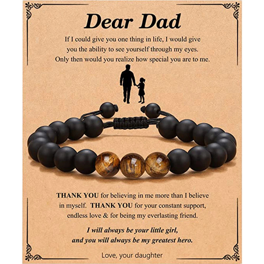 Black beaded bracelet on a brown card with heartfelt message to a father
