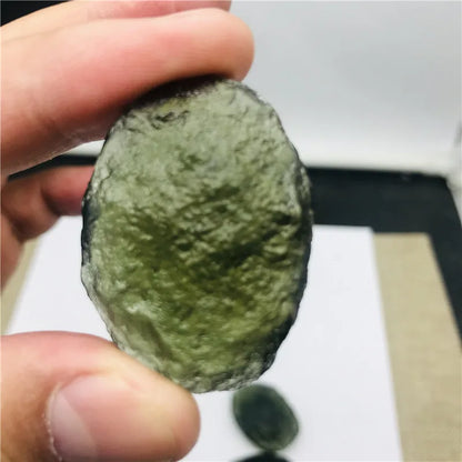 Discover the beauty and energy of our 1PC Raw Natural Rough Cut Green Moldavite. Crafted from the finest quality, this gem is believed to have healing and transformative powers. Add this unique piece to your collection and experience its natural, raw beauty. Perfect for any mineral enthusiast.