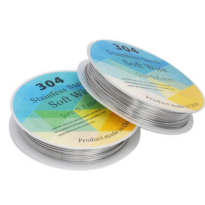 Two spools of 304 stainless steel soft wire with colorful labels on a white background.