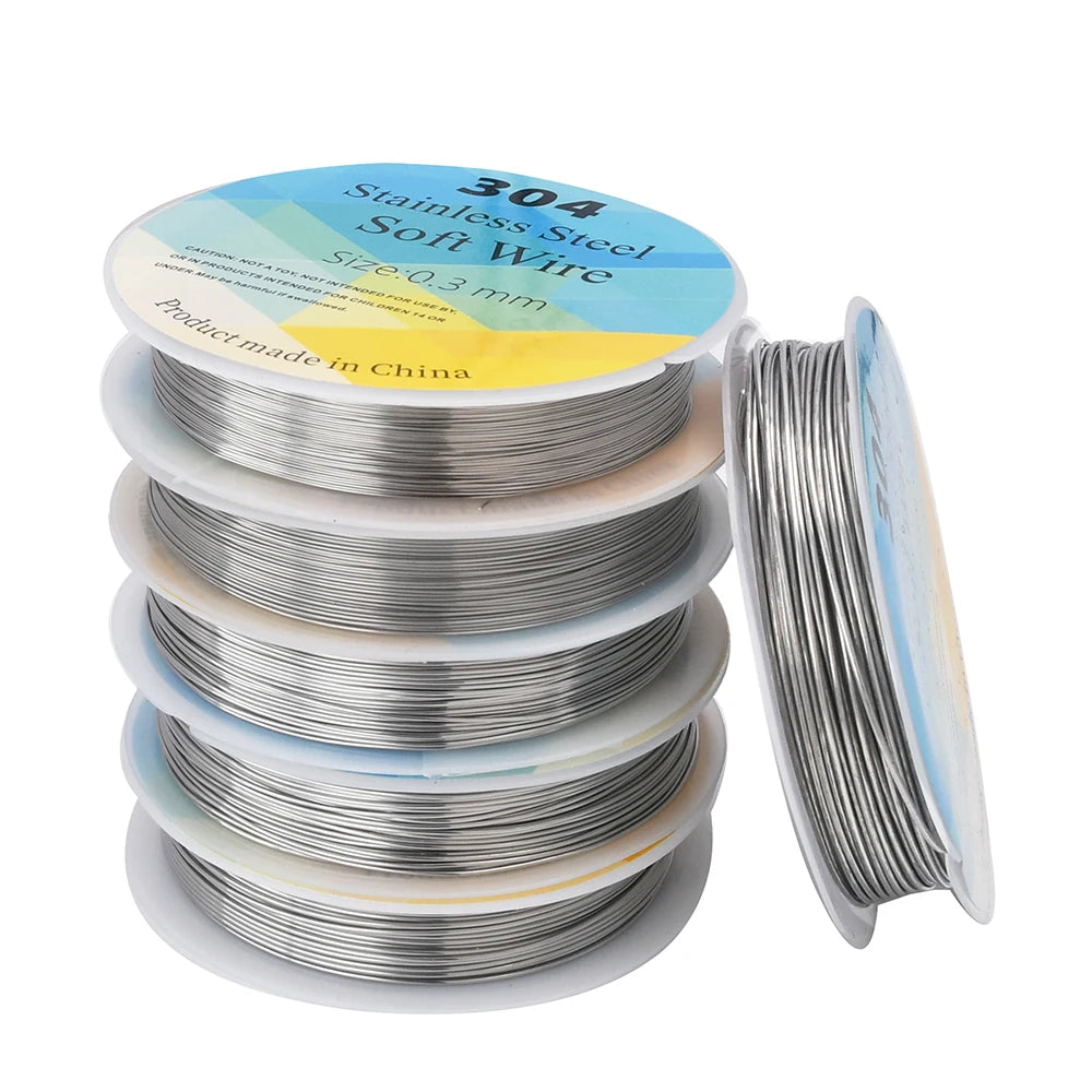 Spools of 304 stainless steel soft wire on a white background