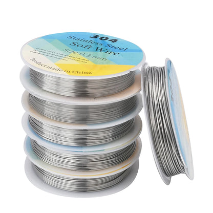 Spools of 304 stainless steel soft wire on a white background