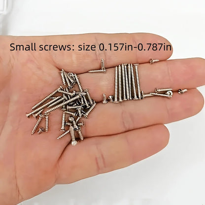 Hand holding small screws with size indication on a white background