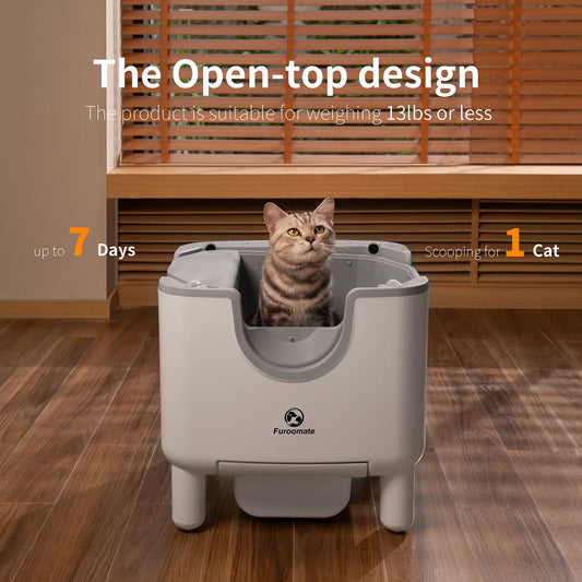 Cat using a pet litter box with text about its features on a wooden floor.