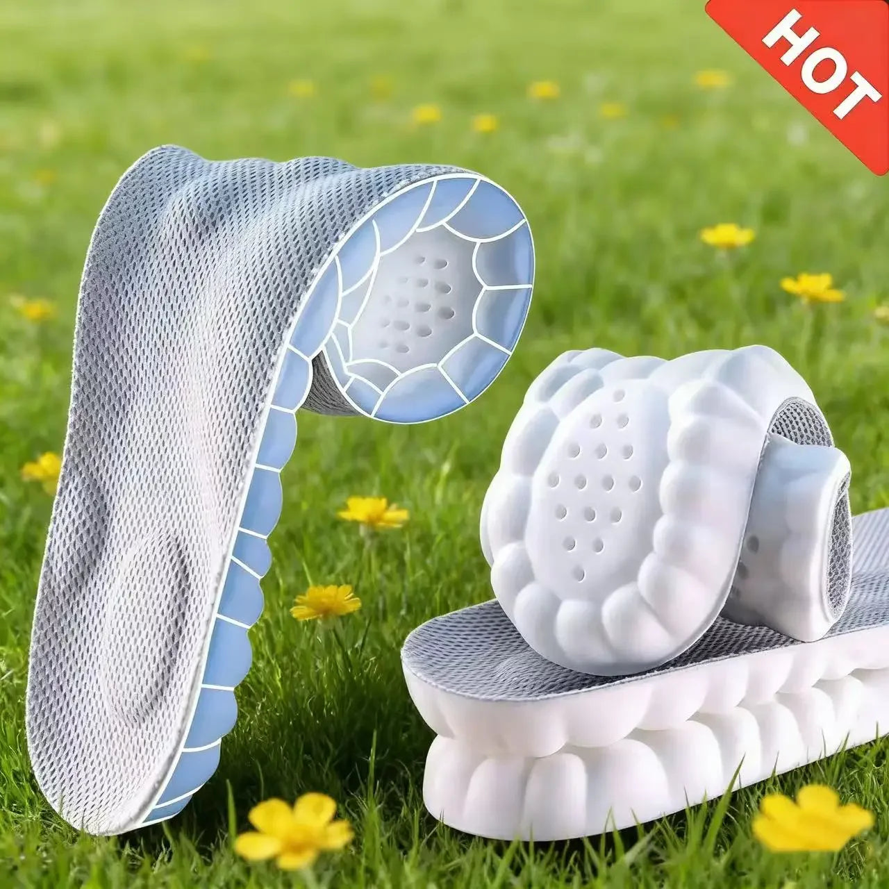 White sandals with blue sole on grass with yellow flowers