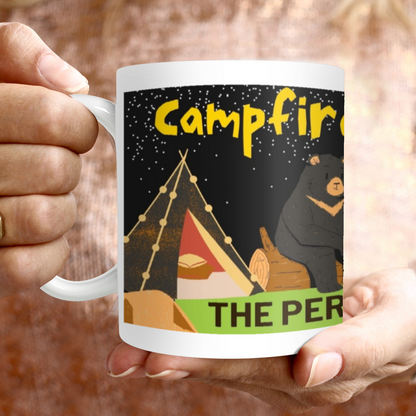 Savor your morning coffee or tea with our Campfire &amp; Friends 11oz Mug! This sturdy ceramic mug features a charming campfire design, perfect for outdoor enthusiasts. Its 11oz size is just right for enjoying your favorite hot beverage. 