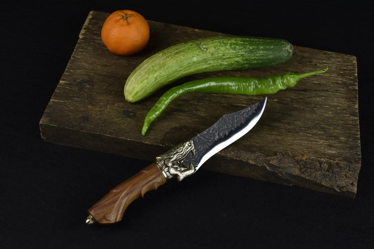 This beautiful Faucet Bone Knife makes a great addition to your home, the details are exquisite and the blade is sharp.  Features a detailed wolf on the handle.  Comfortable to hold and feels steady and strong while cutting. 