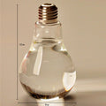 Product Name: Creative Bulb Vase Product material: high boron glass Product size: bottle mouth of about 2.5cm, bottle belly of about 8cm, bottle height of about 14cm Product features: simple fashion, suitable for any corner of the home, will be perfect for good scenery. Instructions: pour the clear water directly into the bottle and insert the plant you like.