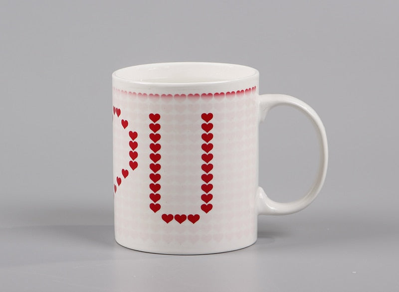An adorable I Love You Magic Temperature Changing Mug that makes a great gift for the love in your life for Valentine's day, anniversary, birthday or any special occasion.  This cool mug changes from cute hearts to I love you when a hot drink is poured into the cup.