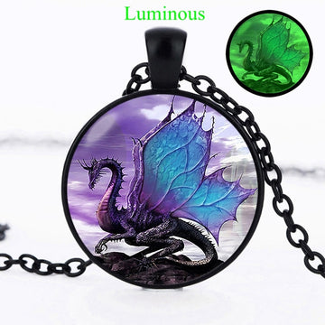 Adorn yourself with the majesty of the sky! This luminous blue dragon necklace & pendant with a black chain is sure to inspire awe. Its vibrant blue hue and bold shape bring an element of the wild and fantastic to any look. Dare to wear the dragon!
