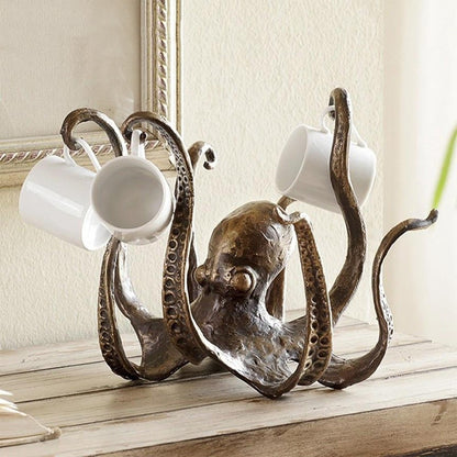 This Bronze Octopus is the perfect table topper for your next party. It holds your mugs for easy access, so party goers can dip into your punch at ease. The arms of this Octopus mug holder is perfect to hold small to medium size mugs and is a unique decoration to celebrate your unique style. 