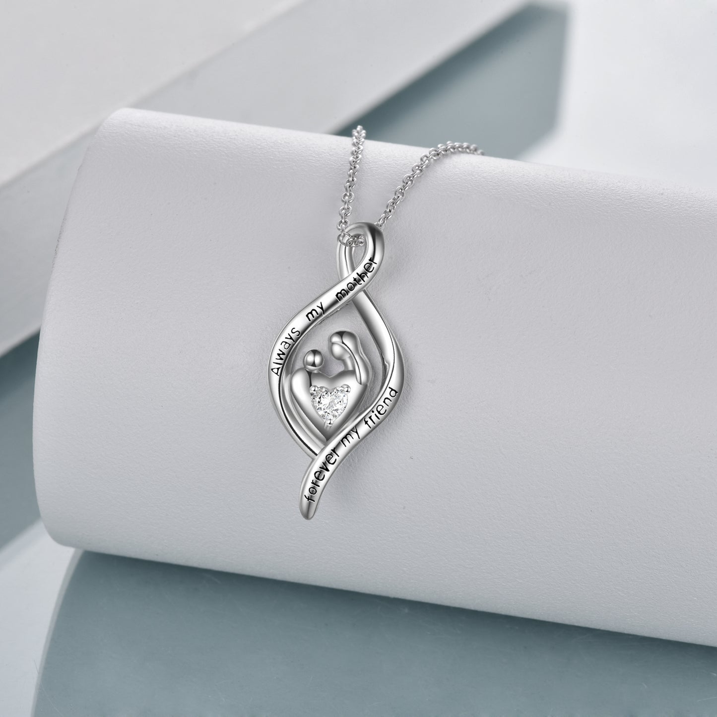 Mother holding child love heart pendant necklace means a mother's love is forever, engraved" Always my mother, forever my friend", express your love to mom with this heartfelt fashion pendant. It's a special gift that she will keep forever.