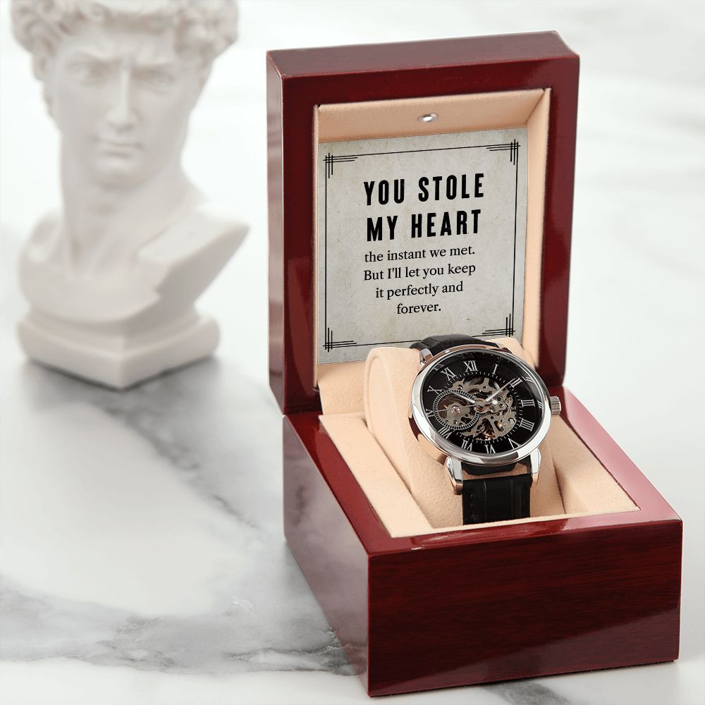 This watch sports a genuine leather strap, is splash resistant, and has increased durability thanks to hardened mineral glass. Our unique skeleton dial feature allows you to peer directly into the inner workings of your watch. Beautifully crafted to be automatic, this watch requires motion instead of batteries. 