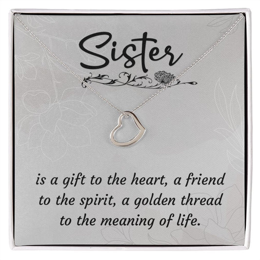 Imagine your sister's delight when she sees this beautiful Delicate Heart Necklace, lovingly crafted in sterling silver and dipped in 14k white gold or 18k yellow gold for added luxury. This piece is pure elegance wrapped up in timeless simplicity. Trends may come and go, but this piece will last a lifetime with its classic subtle beauty.