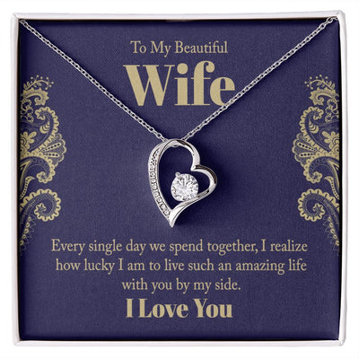 The dazzling Forever Love Necklace is sure to make her heart melt! This necklace features a stunning 6.5mm CZ crystal surrounded by a polished heart pendant embellished with smaller crystals to add extra sparkle and shine. Beautifully crafted with either a white gold or yellow gold finish, be sure to give her a classic gift she can enjoy everyday.
