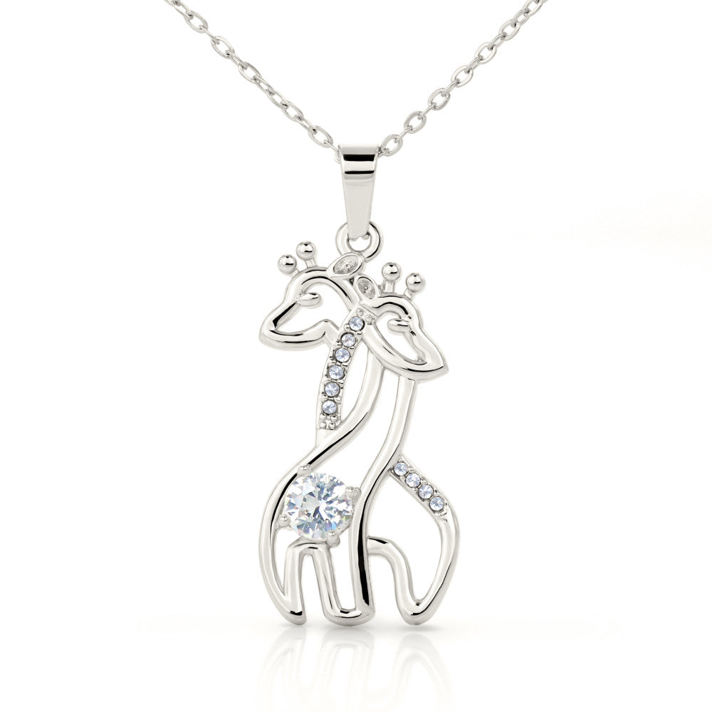 This adorable Graceful Love Giraffe Necklace features sparkling cubic zirconia, and is available in your choice of 14K white gold or 18K yellow gold finishes.  A perfect gift for wives, girlfriends, daughters, granddaughters, best friends, or any one who loves animals