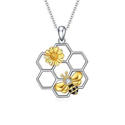 A rolo type chain that is 18 inches with an extra 2 inch extension. Gold and silver pendant with Zircon stone and comes in a delicate jewelry box. 