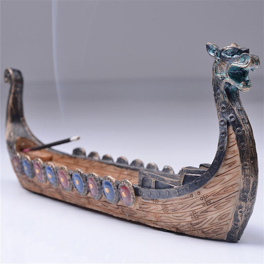Fire up a stick of incense in this calming retro dragon boat incense stick holder and have this boat take your nose on a long, beautifully scented journey to another realm. 